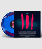 Vinyl record with blue and red color scheme and a black cover featuring red brush strokes and text.