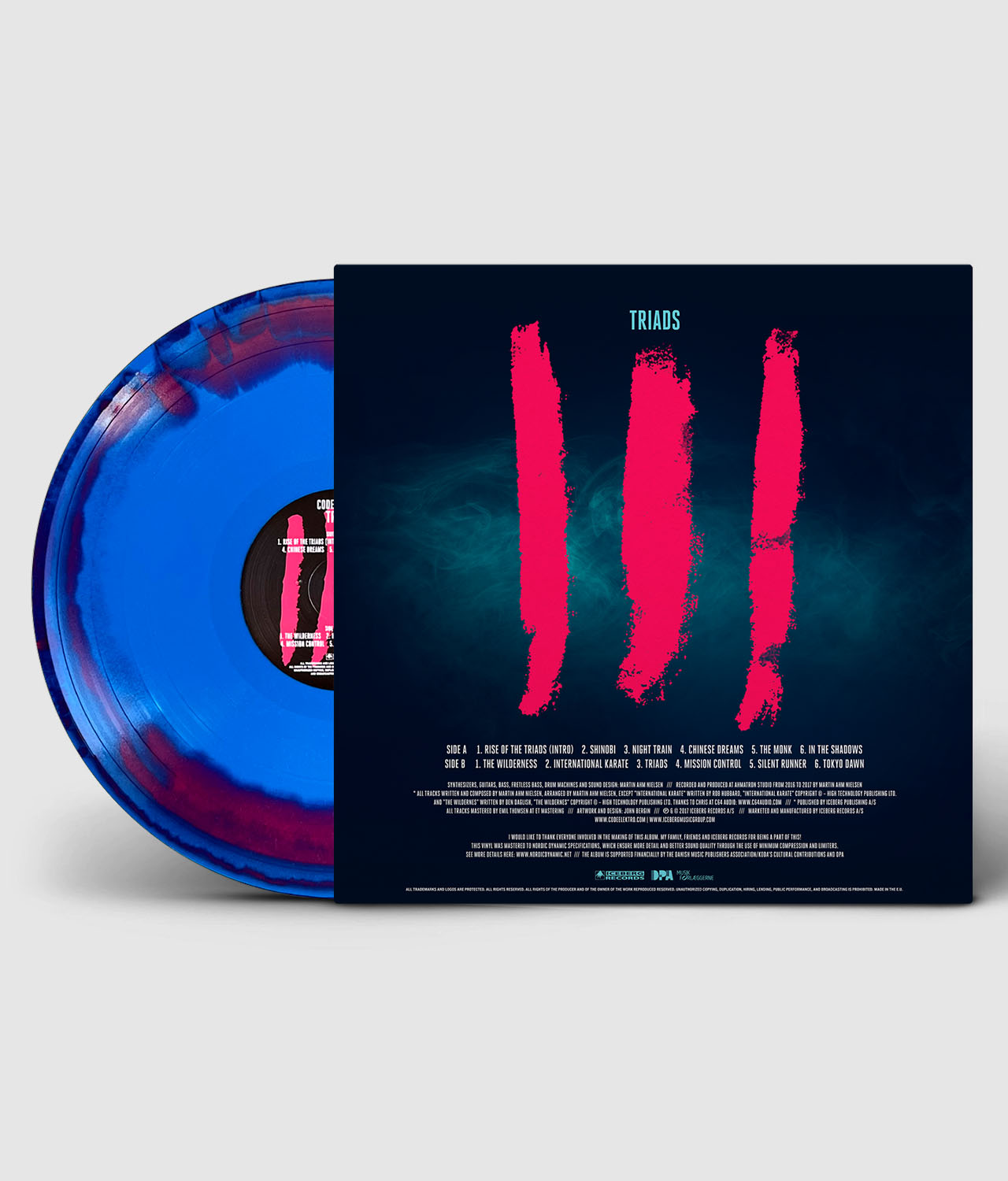 Vinyl record with blue and red color scheme and a black cover featuring red brush strokes and text.